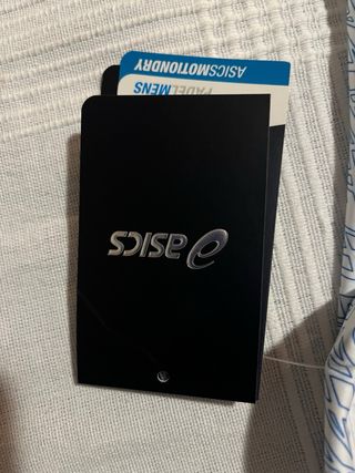 Camiseta Asics azul y blanca Padel