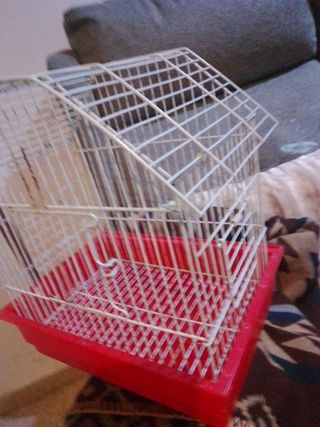 Jaula para pájaros roja y blanca