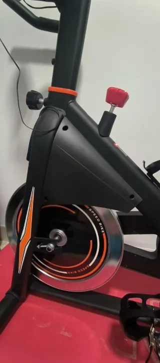 Bicicleta Estática Negra y Naranja