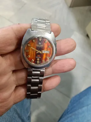 Reloj Ricoh Automático Dorado Naranja.