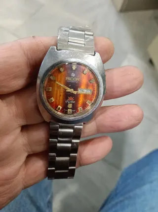 Reloj Ricoh Automático Dorado Naranja.