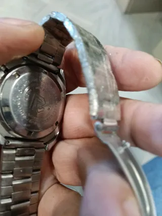 Reloj Ricoh Automático Dorado Naranja.