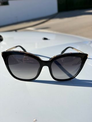 Gafas de sol Tous negras y doradas