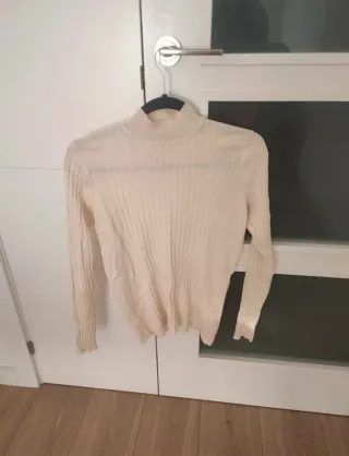 Jersey canalé cuello alto mujer beige