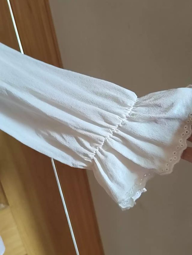 Camicetta bianca trasparente con rouches