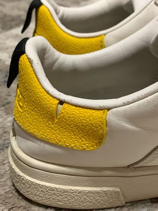 Scarpe Diesel bianche con dettagli gialli