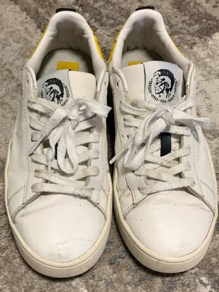 Scarpe Diesel bianche con dettagli gialli