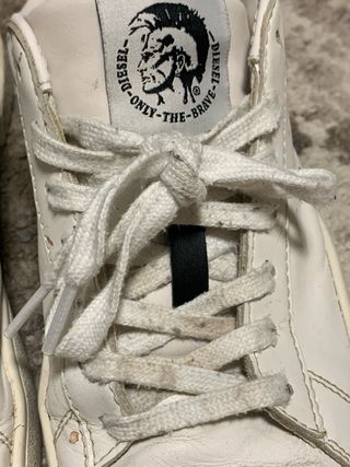 Scarpe Diesel bianche con dettagli gialli