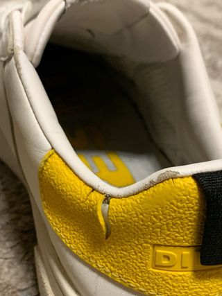 Scarpe Diesel bianche con dettagli gialli