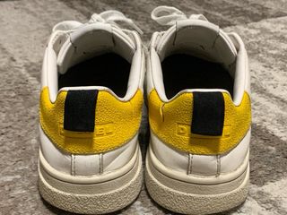 Scarpe Diesel bianche con dettagli gialli