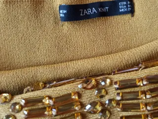 Jersey dorado con pedrería