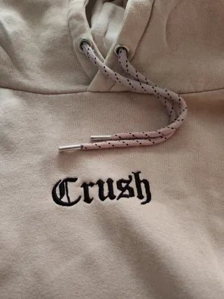 Sudadera rosa con capucha y estampado