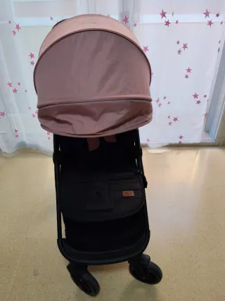 Carrito de bebé rosa y negro