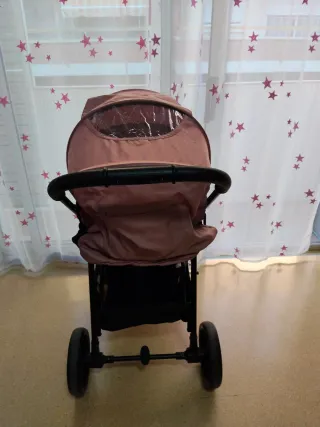 Carrito de bebé rosa y negro