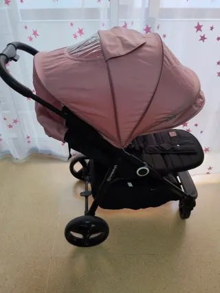 Carrito de bebé rosa y negro