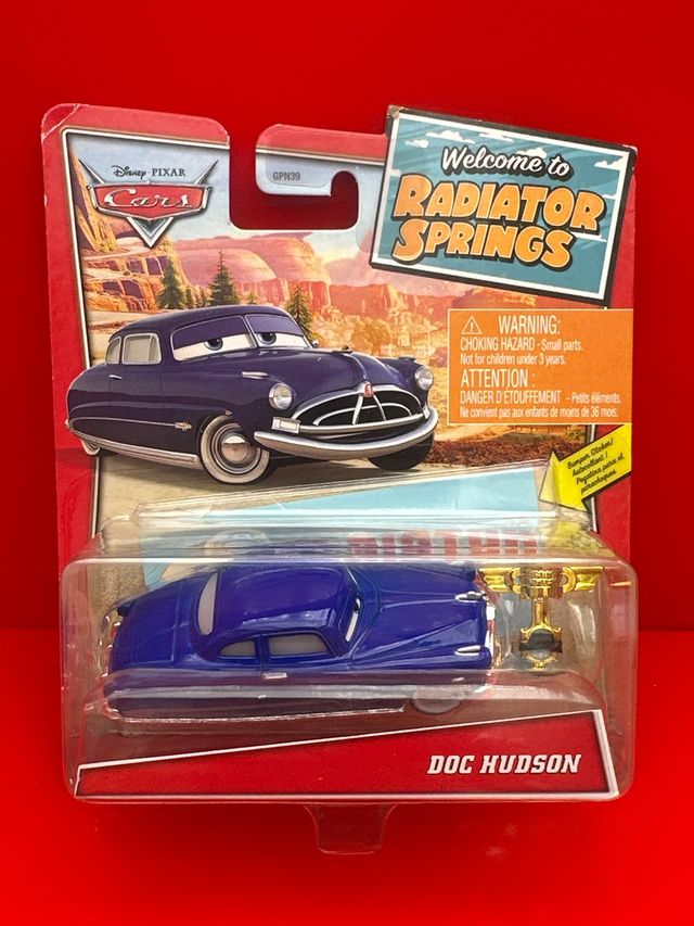 Disney Pixar Cars Doc Hudson + Piston Cup