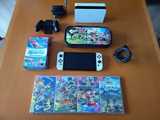 Nintendo Switch OLED + funda + 5 juegos