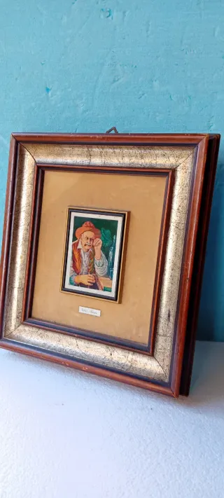 Quadro con cornice dorata