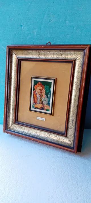 Quadro con cornice dorata