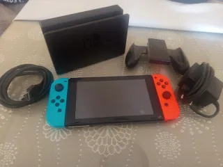 Nintendo Switch + Cargador y Accesorios