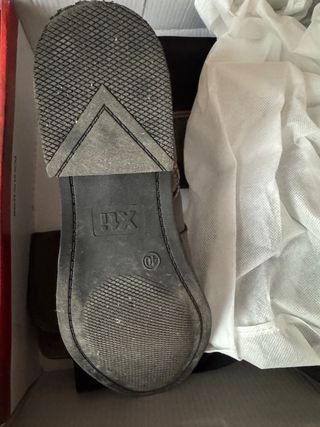 Botas altas de piel marrones y negras