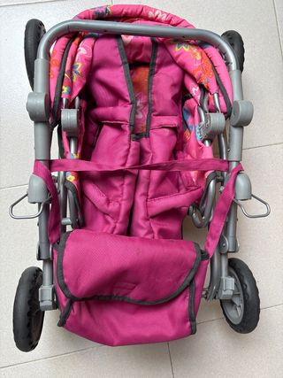 Carrito de muñecas rosa con mariposas