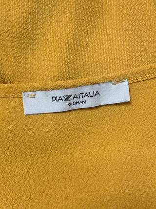 Blusa gialla con zip