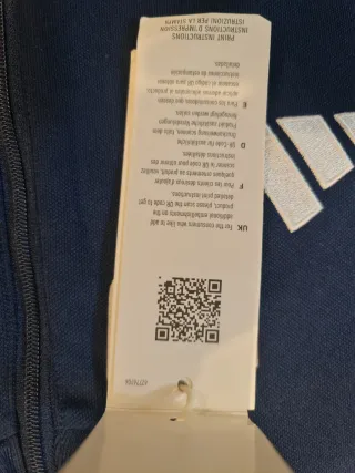 Polo Adidas azul con rayas blancas