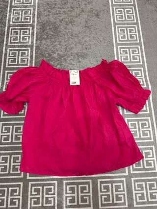 Blusa rosa con volantes