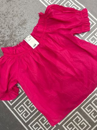 Blusa rosa con volantes