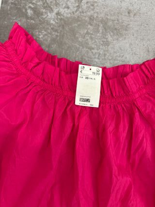 Blusa rosa con volantes