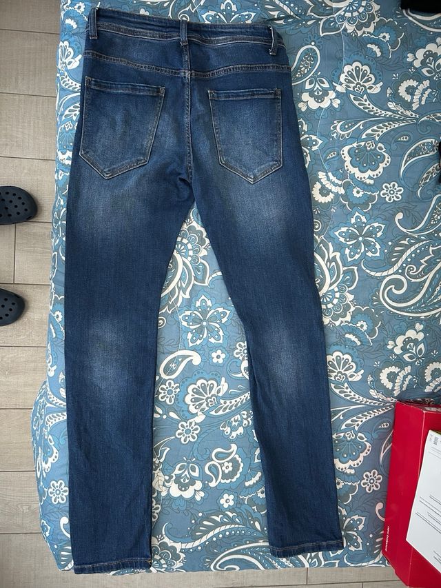 Jeans uomo blu strappati taglia 42