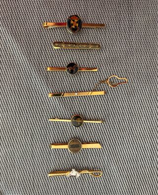 Lote de 7 pasadores de corbata dorados