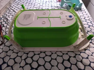 Bañera plegable verde y asiento para bebe