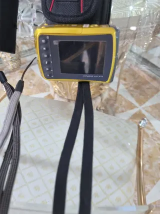 Fotocamere Nikon e Braun con accessori