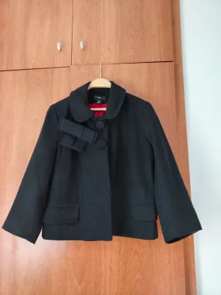 Americana negra casi sin uso