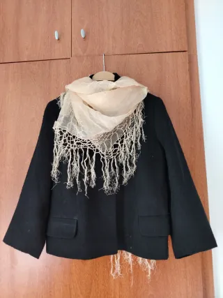 Americana negra casi sin uso