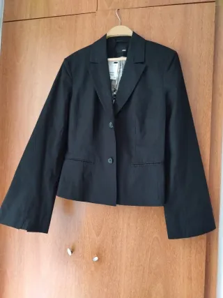 Americana negra casi sin uso