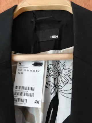 Americana negra casi sin uso