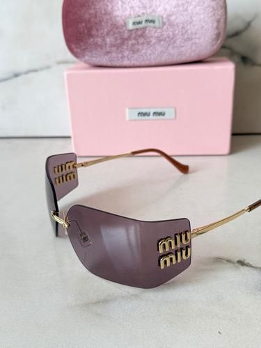 Gafas de sol Miu Miu moradas y doradas