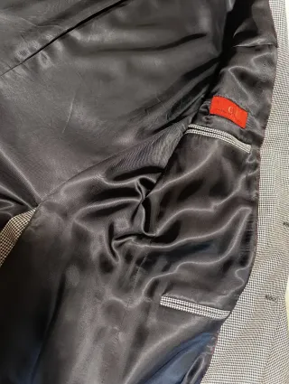 Americana Carolina Herrera gris con coderas