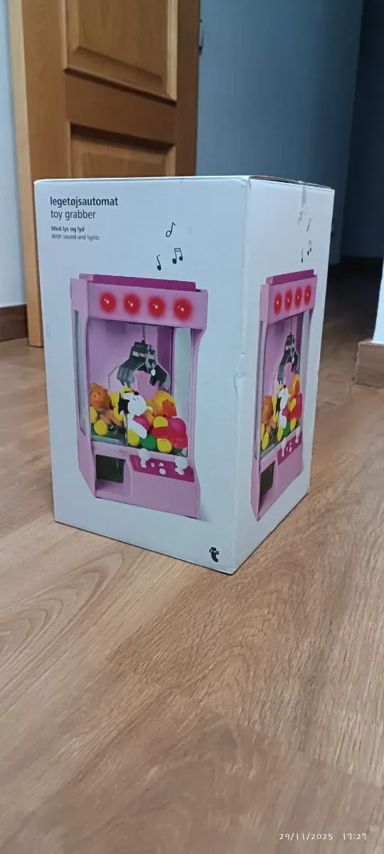 Máquina de garra de juguetes rosa