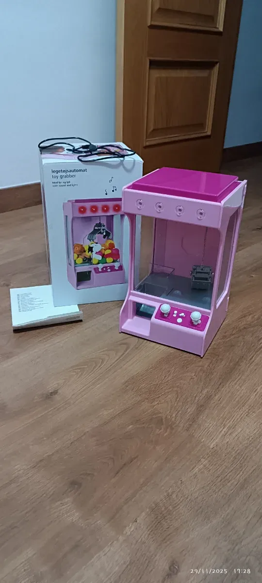 Máquina de garra de juguetes rosa