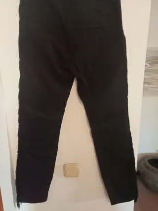 Vaqueros negros Tex con flecos Talla L