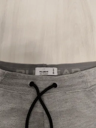 Pantalón corto gris con cremalleras