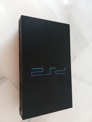 Consola PlayStation 2 con juegos y accesorios