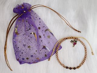 Pulsera macramé nude con ojo de tigre y colibrí