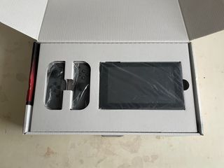 Nintendo Switch + Mario Kart 8 Deluxe + extras