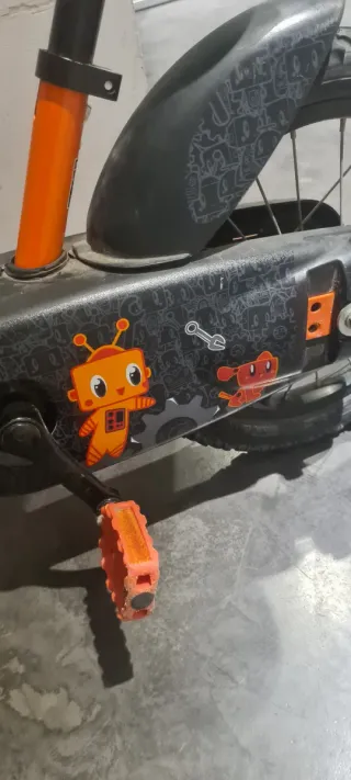 Bicicleta infantil niños naranja con cesta