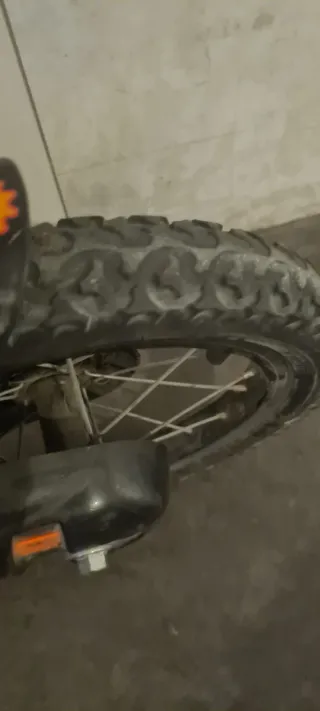 Bicicleta infantil niños naranja con cesta